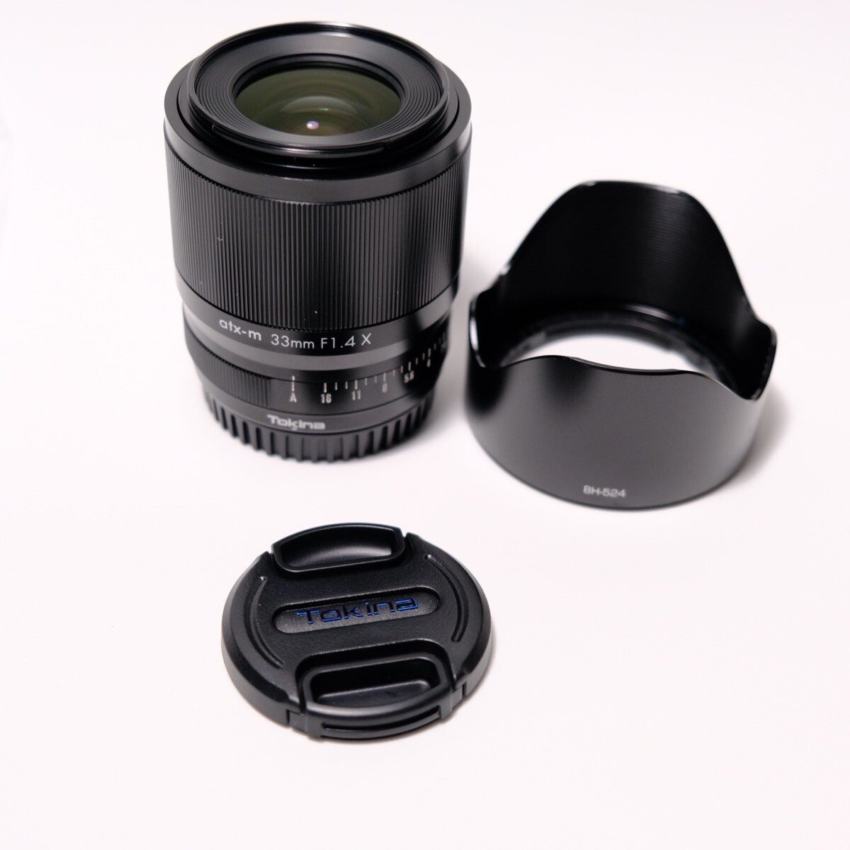 Tokina atx-m 33mm F1.4 無印版附贈配件：前鏡頭蓋 後鏡頭蓋 遮光鏡